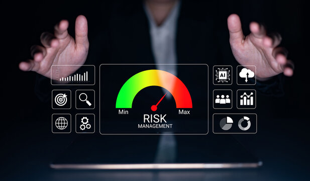 A business professional uses a futuristic risk management dashboard to illustrate assessment tools and metrics for effective decision-making in a corporate environment. Cyphers