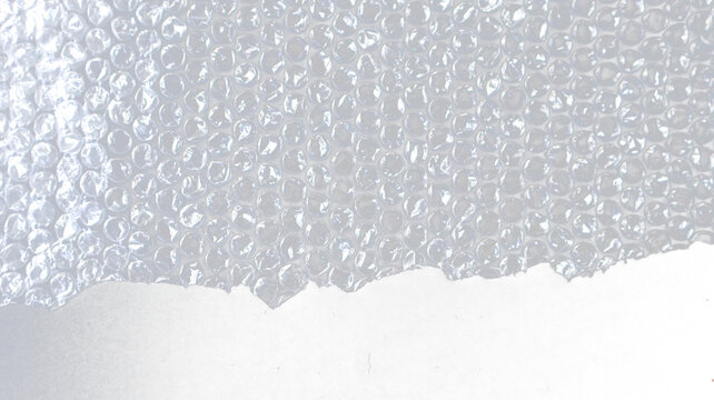 Transparent plastic bubble wrap packaging sheet with individual air cells for shipping, protective cushioning, logistics, and graphic design