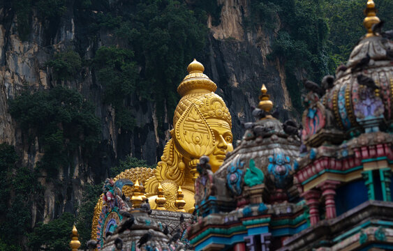 golden lord murugan statue at batu caves in kuala lumpur, malaysia. travel photography