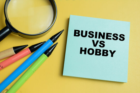 Concept of business vs hobby write on sticky notes isolated on table.