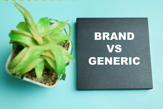 Concept of brand vs generic write on sticky notes isolated on table.
