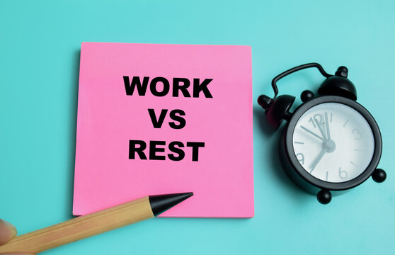 Concept of work vs rest write on sticky notes isolated on table.