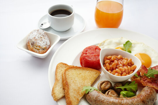 Full english breakfast with coffee and orange juice