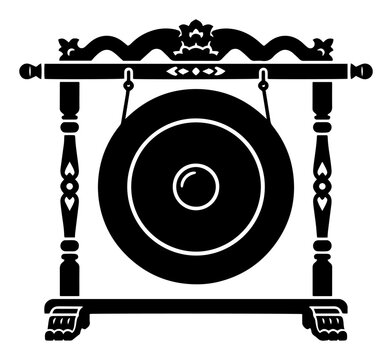 Ceremonial gong hanging on carved ornate wooden stand in black silhouette style