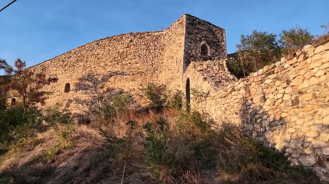 sunlit stone walls of prizren castle at sunset in kosovo video