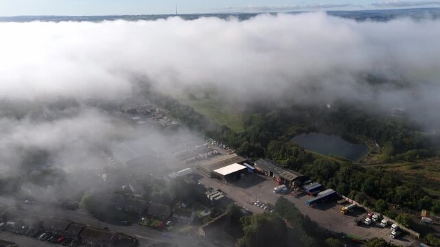 Clouds obscure town below. Industrial, Dewsbury, Yorkshire
