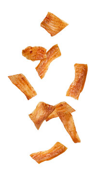 Falling chicken Jerky, dried meat isolated, full depth of field