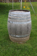 Barrel on a lawn with a tent in the background © Frank