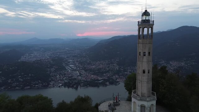 aerial view Volta monument Como sunset dramatic sky architectural landmark illuminated structure tourist destination Lombardy Italy