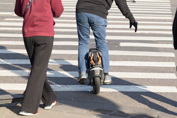 A man is riding a monowheel around the city. © Александр Поташев