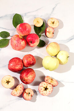 Assortment of apple varieties on a concrete table, Thanksgiving background, concept of healthy, natural eating and the harvest, banner for cafes and restaurants, detox diet and body cleansing,