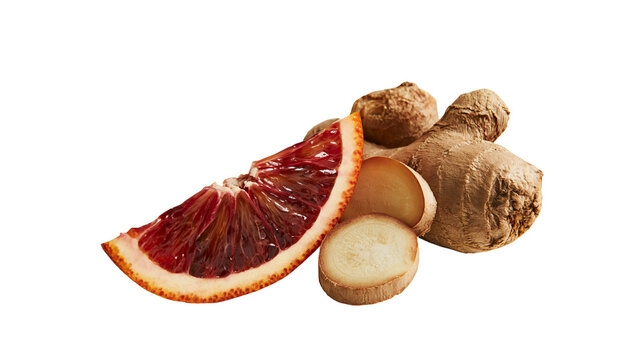 Isolated slice of blood orange with fresh ginger root and sliced pieces on a clean backdrop.