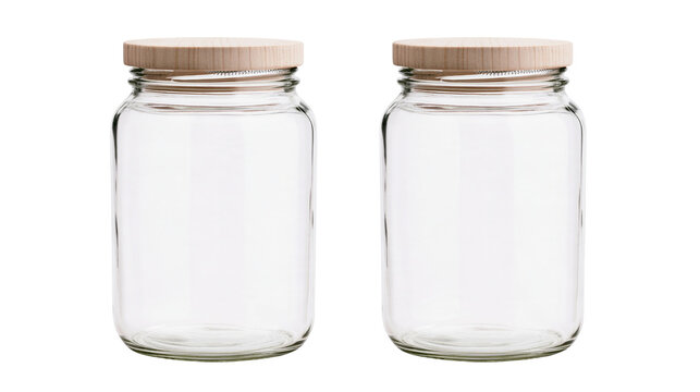 Isolated two empty clear glass food storage jars with natural light wood lids