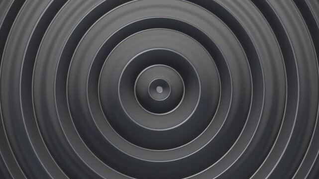 Matte obsidian ripples undulating in rhythmic concentric patterns for luxury speaker branding