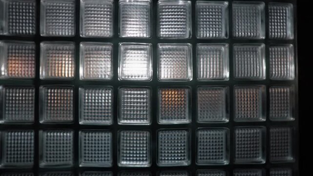 Light moving behind a glass block wall