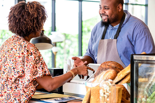 Friendly bakery customer interaction photo