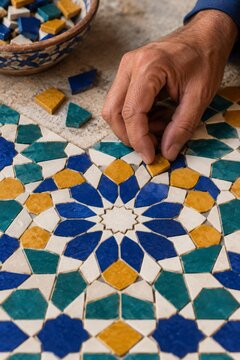 Mosaic Artisan Arranging Blue Yellow and White Tiles by Hand