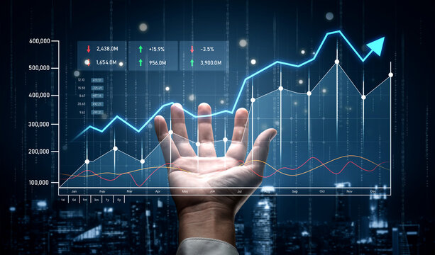 A hand reaches out toward a vibrant digital display of financial graphs and trends, illustrating growth and analysis in a modern business environment, symbolizing success. Scalp