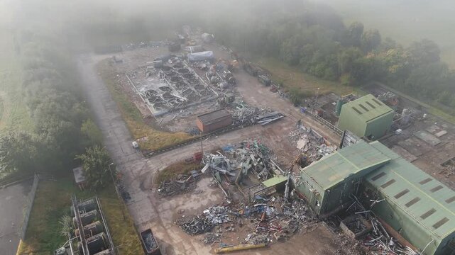 Trees frame the site. Industrial, Dewsbury, Yorkshire