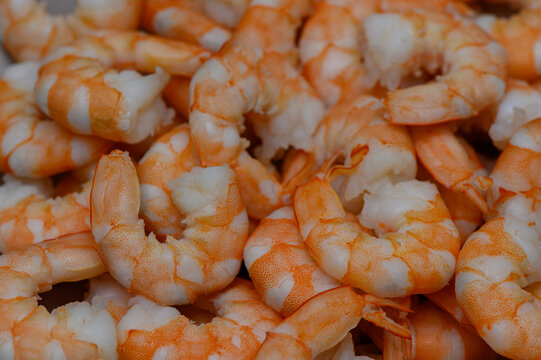 Delicious cooked peeled shrimps background pattern
