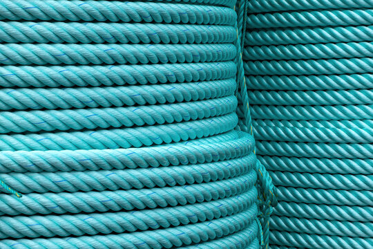 Factory-new turquoise ropes wound on large reels for the fishing fleet