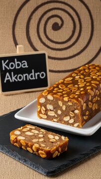 Traditional Malagasy Koba Akondro Banana Peanut Dessert with Chalkboard Sign on Slate and Ceramic
