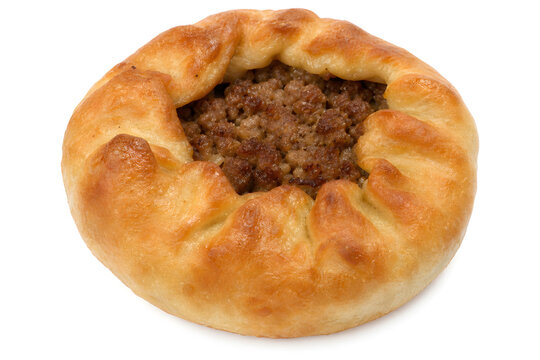 Tatar peremech, round fried meat pastry with open center exposing brow Isolated on White Background