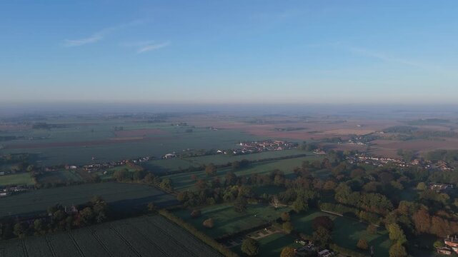 Blue skies stretch over quiet countryside