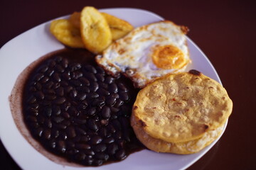 Guatemalan breakfast with beans eggs plantains and tortillas © nobito_gt