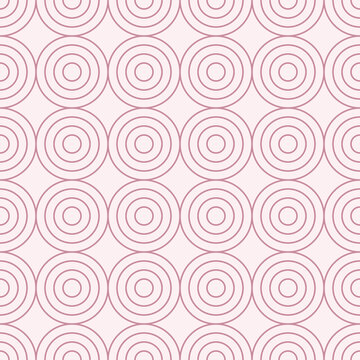 Seamless pattern with concentric dusty pink circles on a pale blush pink background