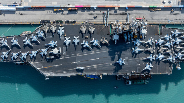Aerial view nuclear powered aircraft carrier, USA navy ship carrier airplane fighter jet aircraft army navy nuclear ship carrier full fighter jet aircraft technology of battleship.