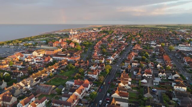 Sunset casts warm glow over seaside town