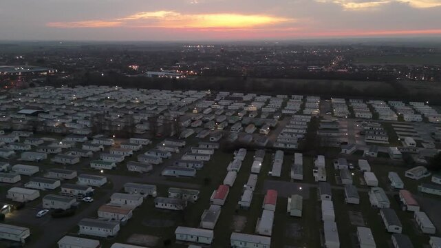 Aerial view of a vast caravan park at twilight