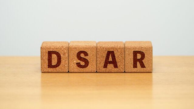 DSAR on four cork wooden blocks - data subject access request concept