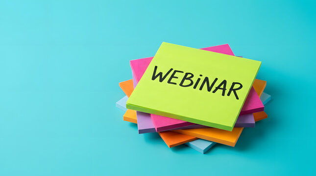 A disorganized stack of square sticky notes in various colors like lime green, pink, orange, and blue placed centrally on a bright turquoise surface, with webinar written on the topmost note