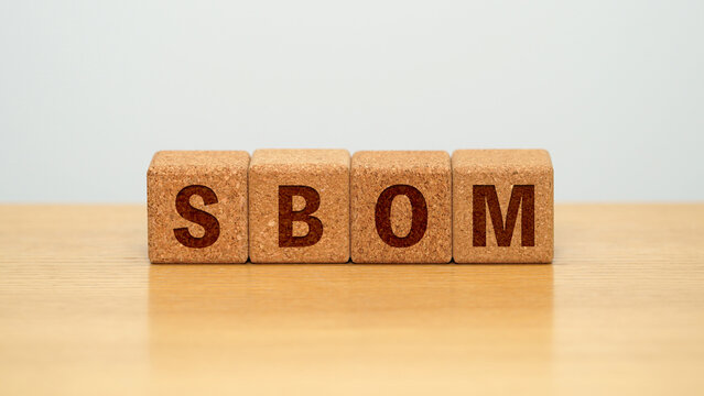 SBOM on four cork wooden blocks - software bill of materials concept