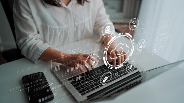 Person Using Laptop with Cloud Computing Interface and Digital Graphics for Technology and Business Concept. Entropy.