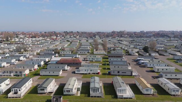 Aerial view shows rows of white mobile homes