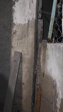 Pouring Cement Mortar Into Wall Void With Rebar Column