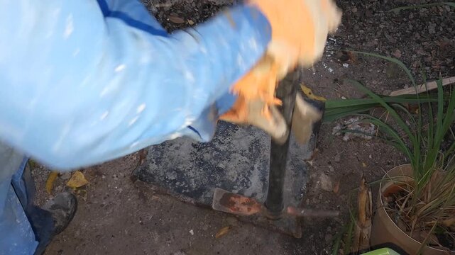 Flattening Old Sheet Metal By Striking With Pickaxe