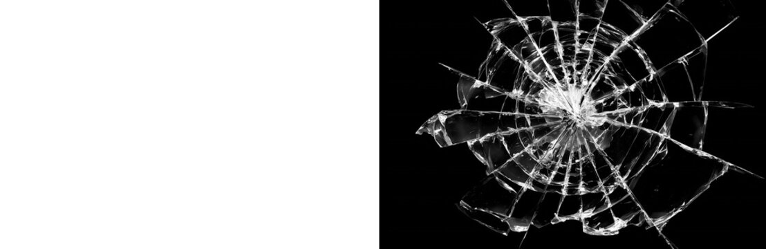 Shattered glass hole with dramatic radial cracks spreading outward across dark surface isolated on transparent background