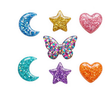 Set of colorful glittery resin charms including moons stars hearts and a butterfly isolated on transparent background