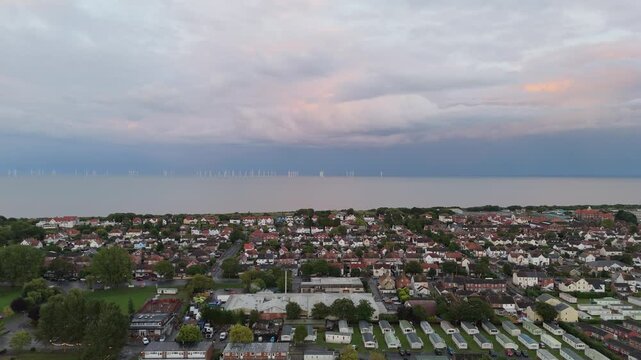 Aerial view shows coastal town at dusk