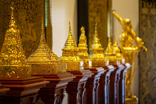 A Row of Golden Buddhist Stupas Inspires Mindfulness and Reflection on the Path to Wisdom and Inner Peace