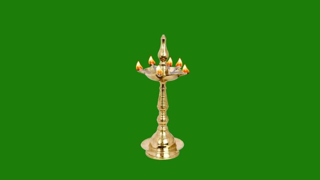 Glowing golden brass stand diya lamp flame animation isolated on keyable chroma key green screen
