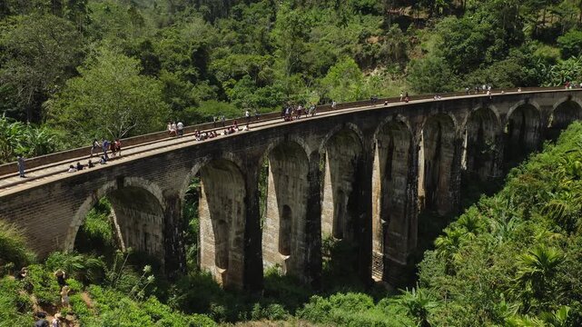 Nine Arches Bridge in Sri Lanka with Tourists Under Bright Sunlight