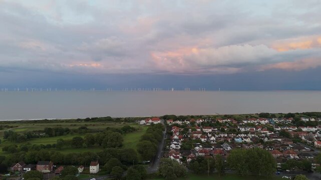 Aerial view shows coastal town at dusk
