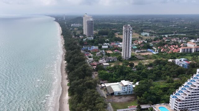 Aerial View of Coastal Shoreline with Tropical Beach and High Rise Buildings