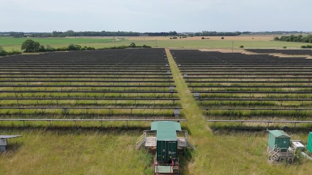 Aerial view of solar panels in open field