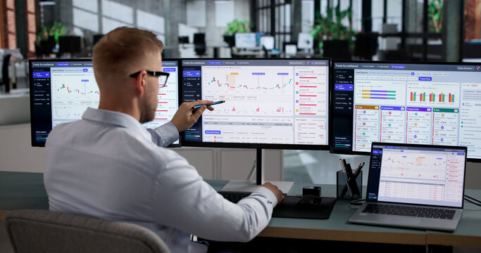 Financial Analyst Carefully Reviews Digital Transaction Data
